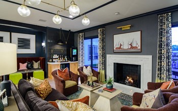 a living room filled with furniture and a fire place - Photo Gallery 5
