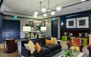 a living room filled with furniture and a large window - Photo Gallery 6