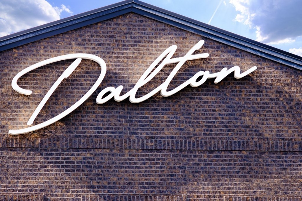 a brick wall with a sign on it at Dalton, New Albany, OH