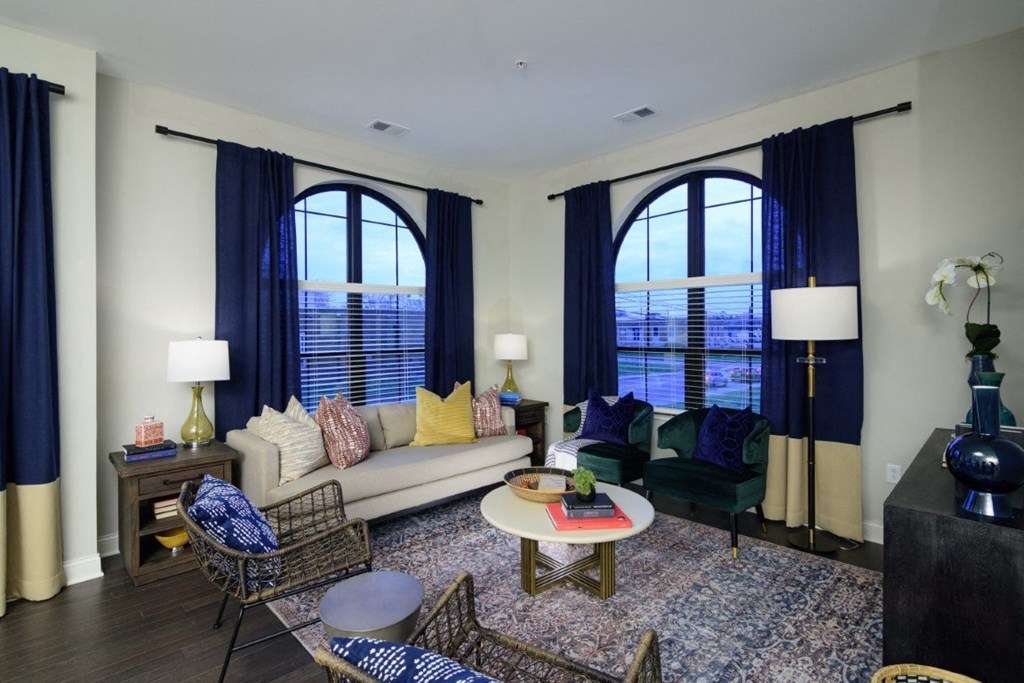 a living room with large windows and a couch and chairs at Fairfax, Ohio, 43212
