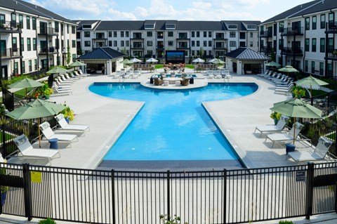 Resort style pool with dual sections and courtyard seating at Kempton Apartments, Columbus, OH 43235