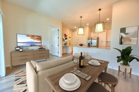 Open dining area with kitchen and pendant lighting at Kempton Apartments, Columbus, 43235