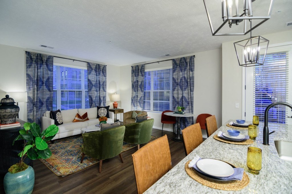 a living room and dining room with a couch and a table at Dalton, New Albany