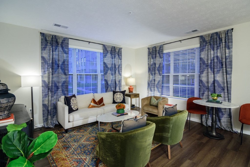 a living room with a couch and chairs and a table at Dalton, New Albany, 43081