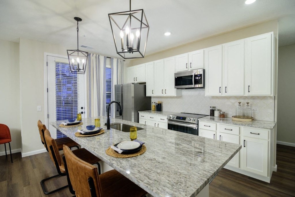 a kitchen with a marble counter top and a table at Dalton, Ohio
