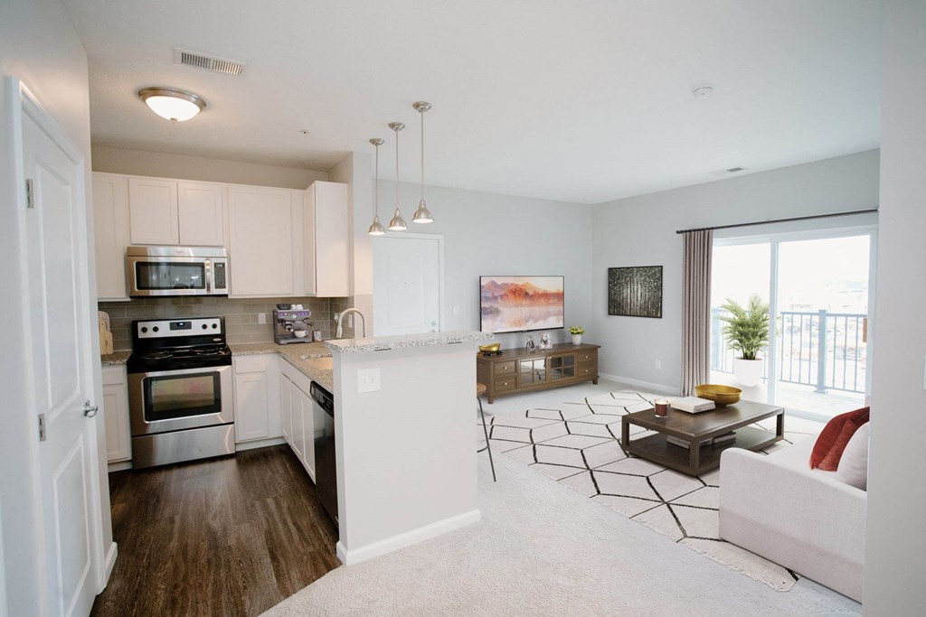 a kitchen and living room in a two bedroom apartment at Kendall Park, Ohio