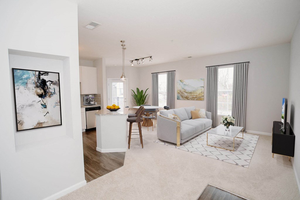 our apartments offer a living room with a couch a coffee table and a kitchenette at Kendall Park, Columbus