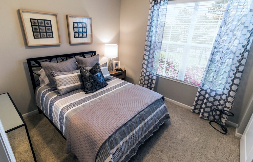 a bedroom with a bed and two windows at Kendall Park, Ohio, 43220