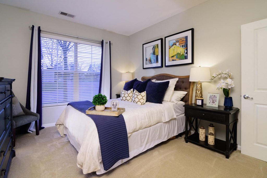 a bedroom with a bed and two nightstands at Kendall Park, Columbus, Ohio