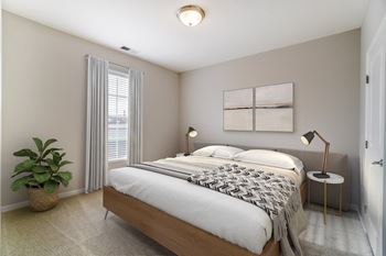 a bedroom with a bed and two windows at Kendall Park, Columbus