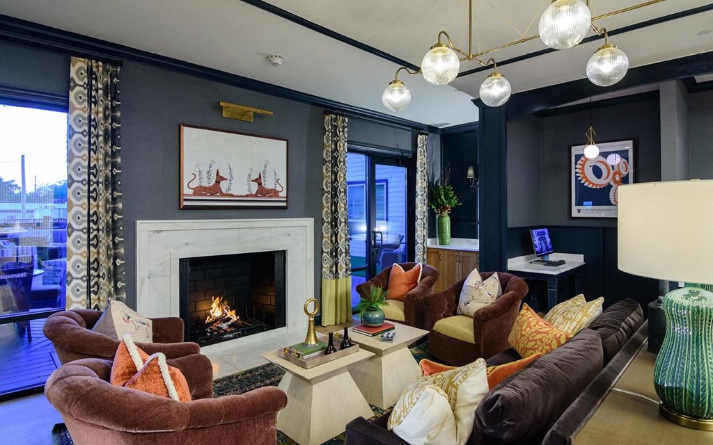 a living room with blue walls and a fireplace at Essex, Columbus, OH, 43212