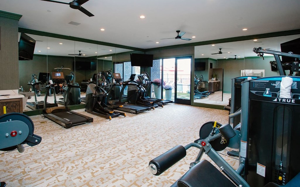 a room filled with lots of different types of exercise equipment at Fairfax, Grandview, Ohio