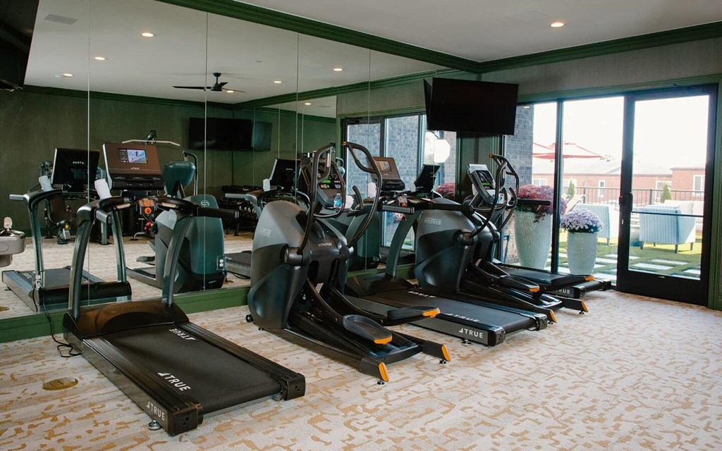 a room filled with lots of different types of exercise equipment at Fairfax, Grandview, OH