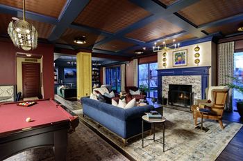a living room filled with furniture and a pool table at Fairfax, Grandview, OH