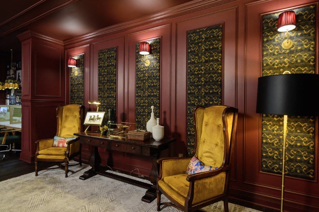 a room with red walls and yellow chairs at Fairfax, Grandview, OH