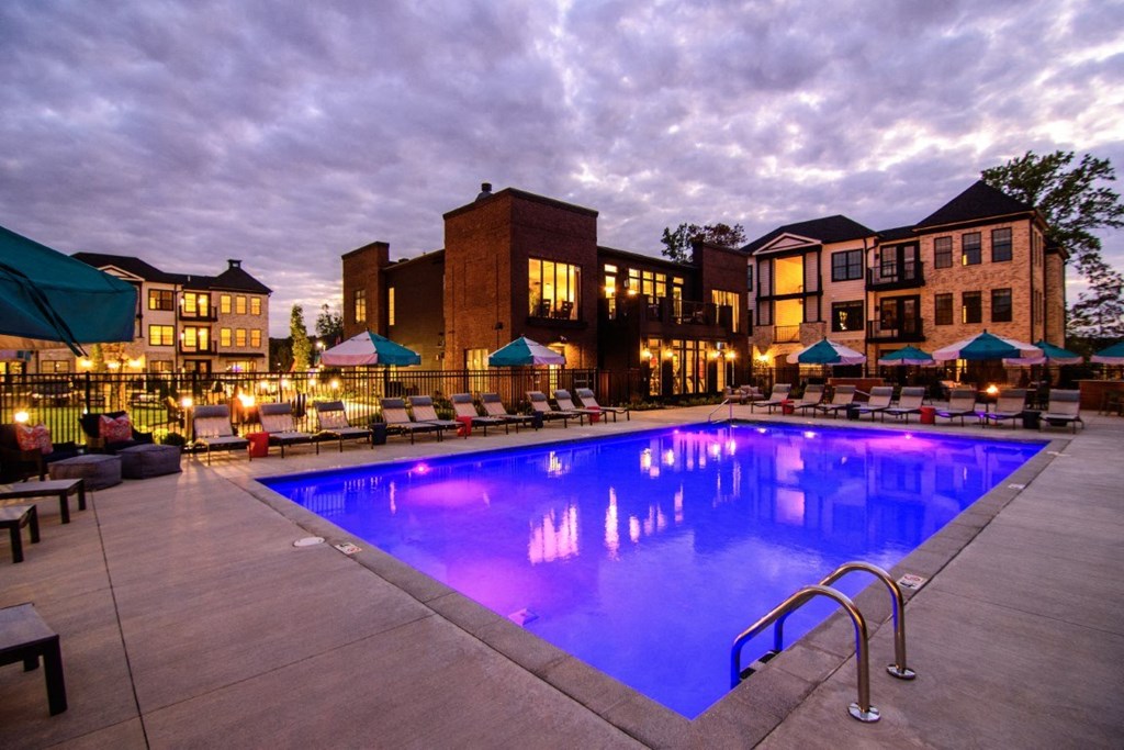 a swimming pool at night in front of a hotel at Dalton, New Albany, OH 43081