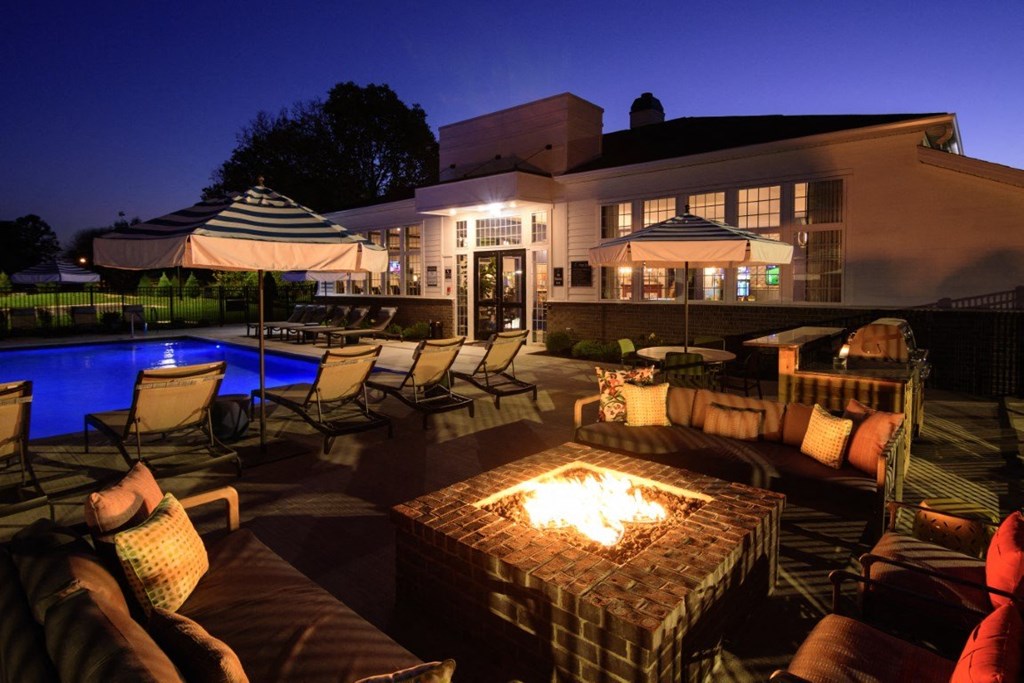 a backyard with a fire pit and chairs and a pool at Elan Park, Ohio, 43231