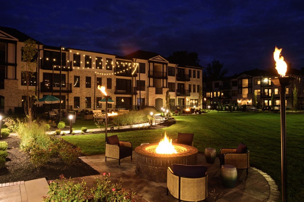 a fire pit in the middle of a courtyard at night at Dalton, New Albany Ohio