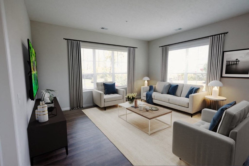 a living room with couches and a coffee table at Kendall Park Too, Columbus