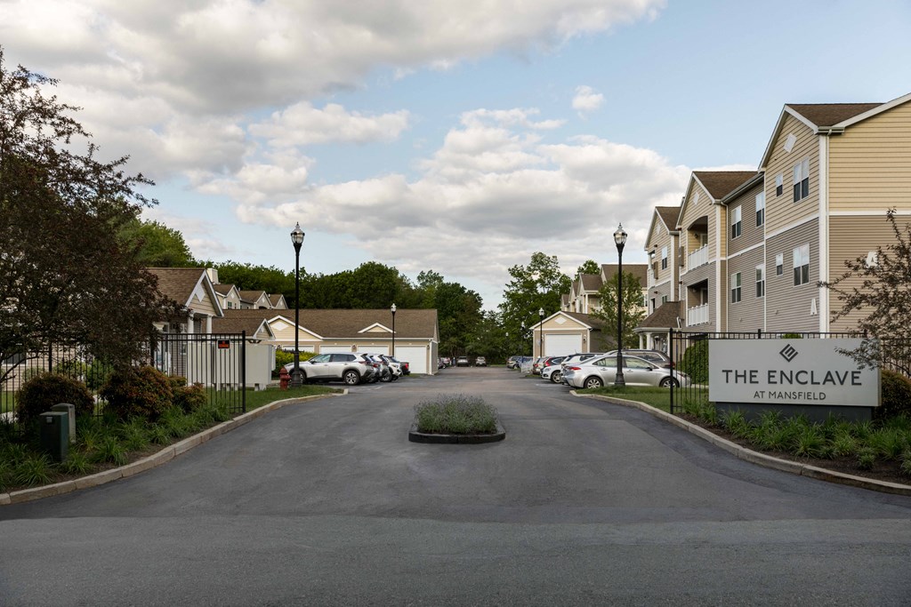 The Enclave at Mansfield is a residential complex with a street leading to the front.