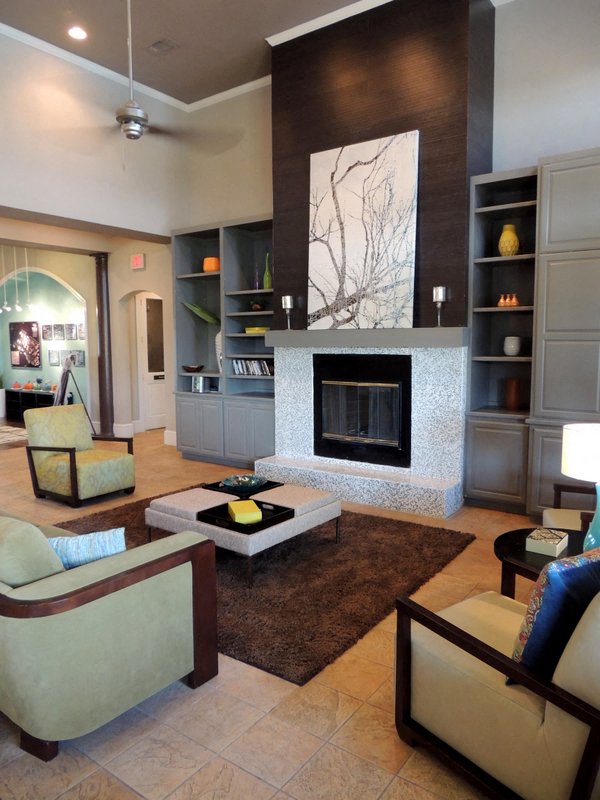 a living room with a couch and a fireplace