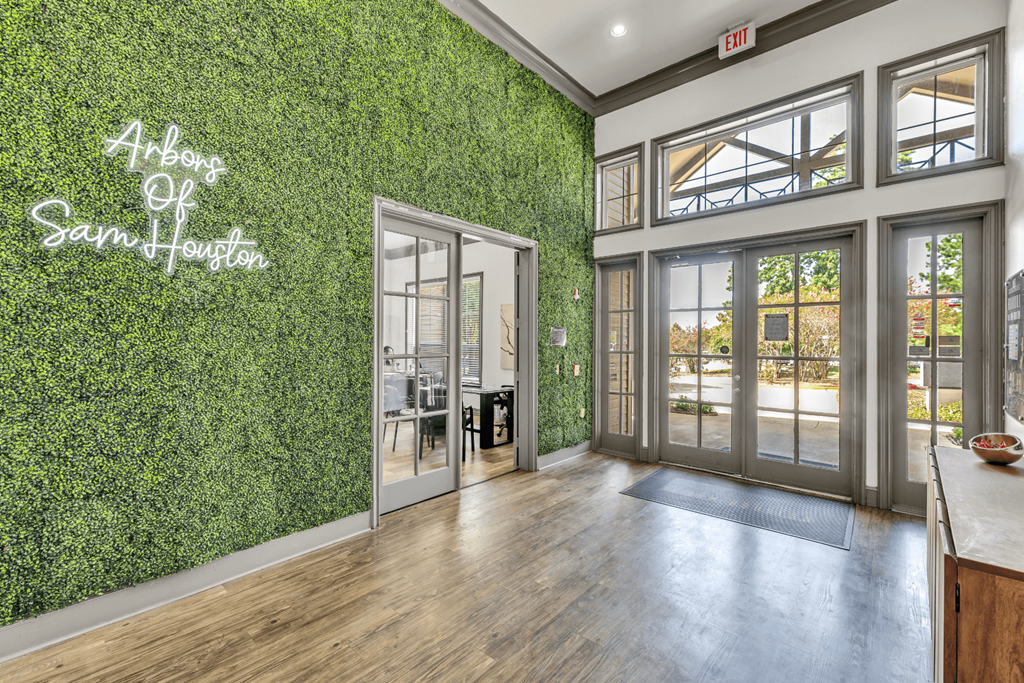 a living wall in a room with glass doors