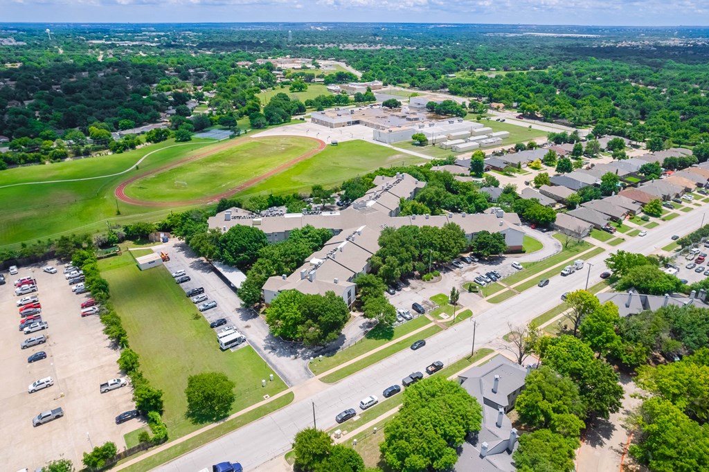 an aerial view of the parking lot of a city park