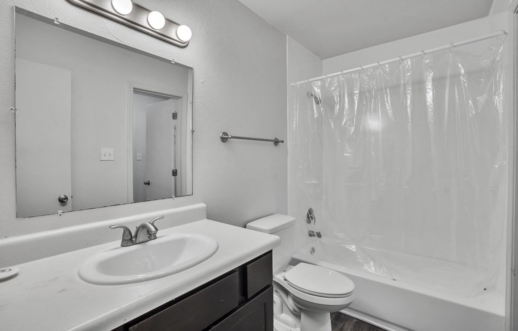 the preserve at ballantyne commons apartment bathroom with sink toilet and shower