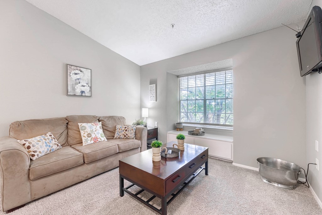 a living room with a couch and a coffee table