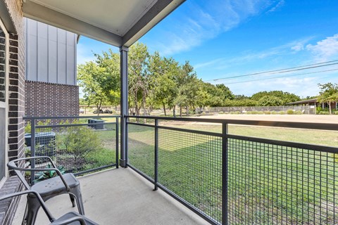 the preserve at ballantyne commons balcony and yard with grass and trees