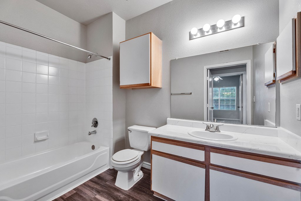 a bathroom with a sink toilet and a bath tub