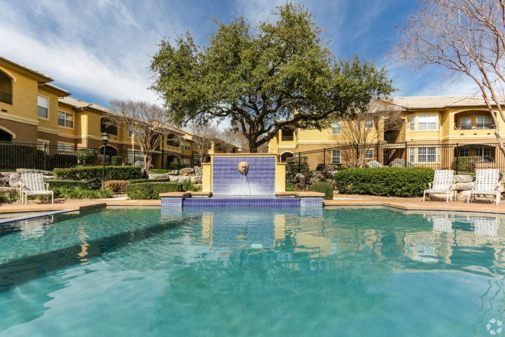 the swimming pool at the preserve at polo terrace apartments