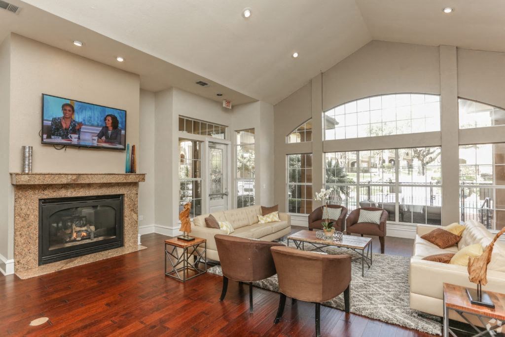 the living room has a fireplace and a large window