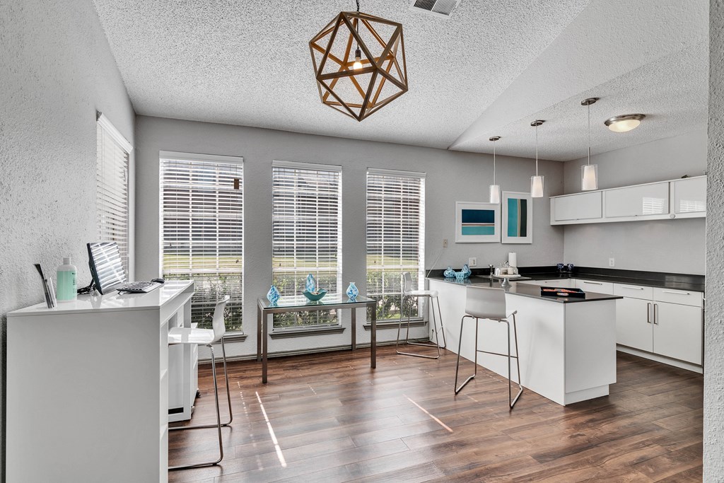 an open kitchen and living room with a large window