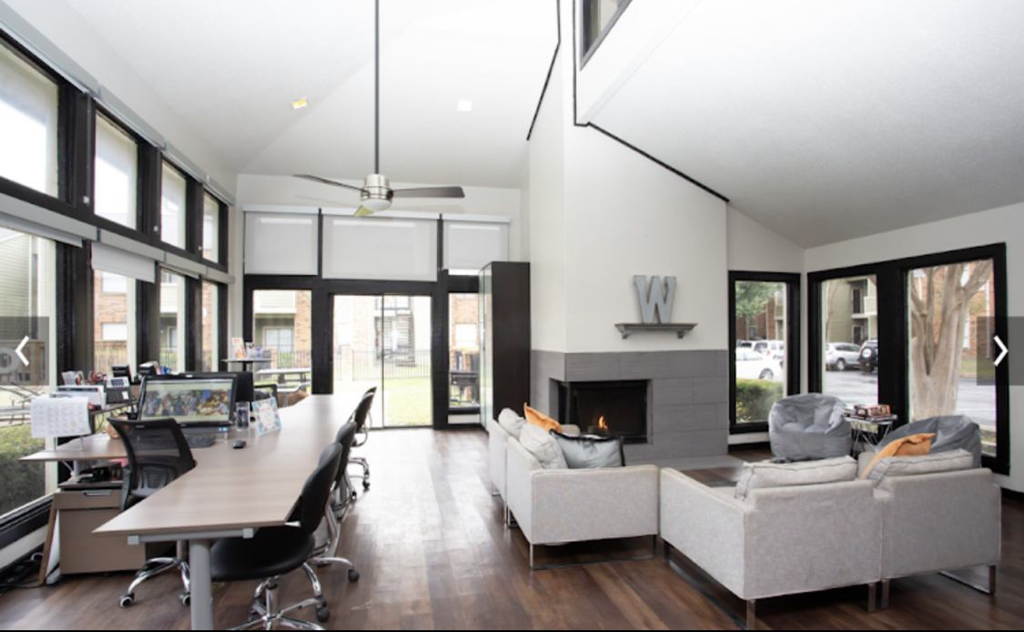 a room with a table and chairs and a fireplace