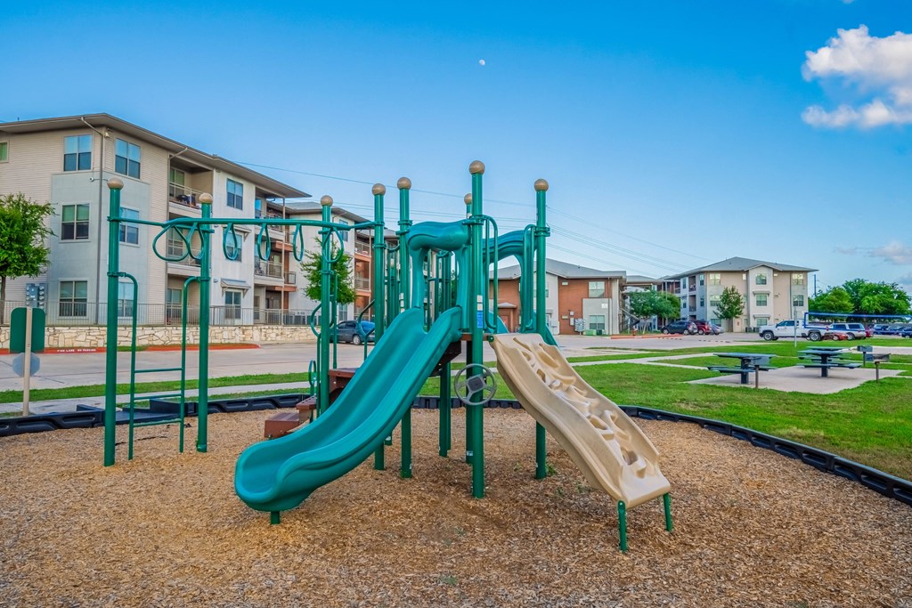the preserve at ballantyne commons playground with slides and buildings