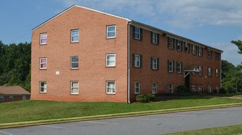a brick building on the side of a street