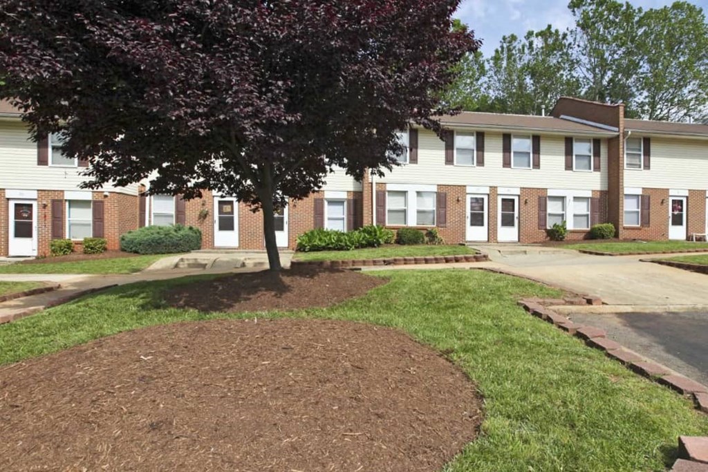 a building with a tree in front of it