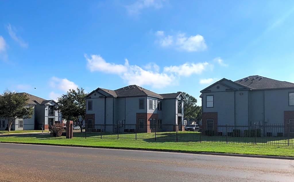 a row of houses on the side of a street