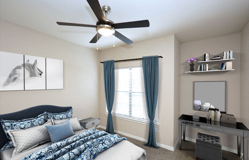 a bedroom with a bed and a desk with a chair and a ceiling fan