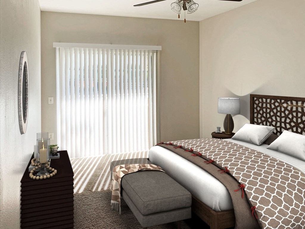 a bedroom with a bed and a dresser and a window