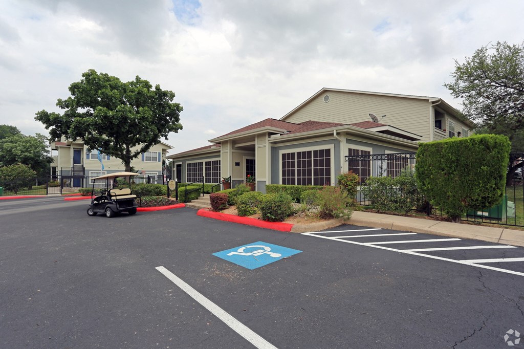 an empty parking lot in front of a building