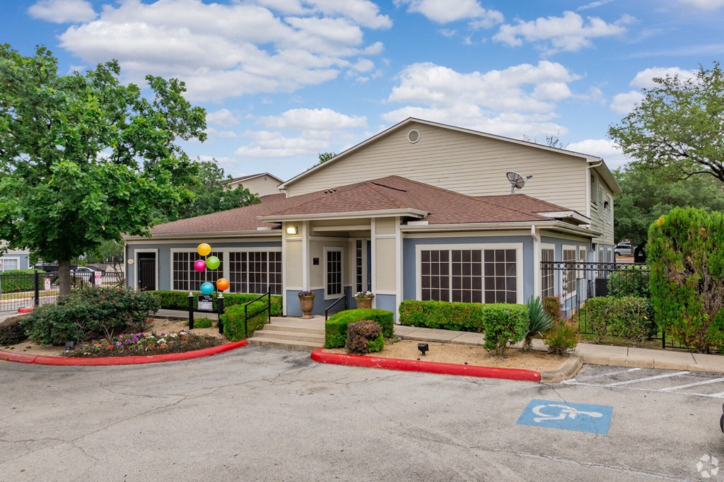 a house with a driveway and a parking lot