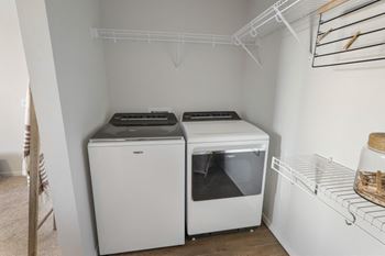 a laundry room with two washes and a dryer in it