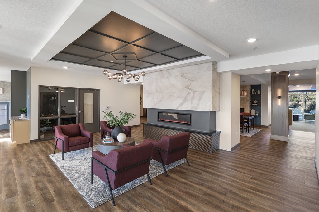 a large lobby area with a fireplace and couches