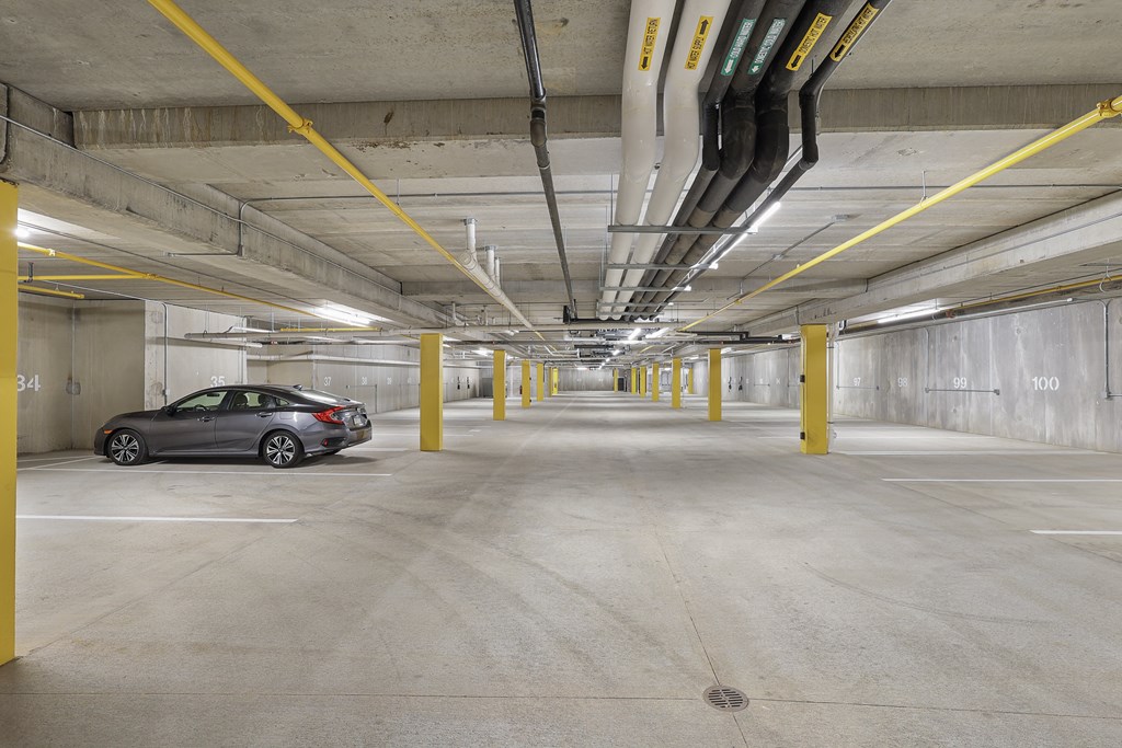 a car parked in an empty parking garage