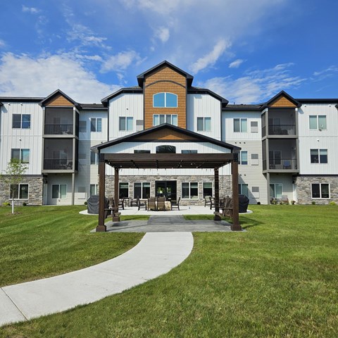 A large building with a gazebo in front of it.