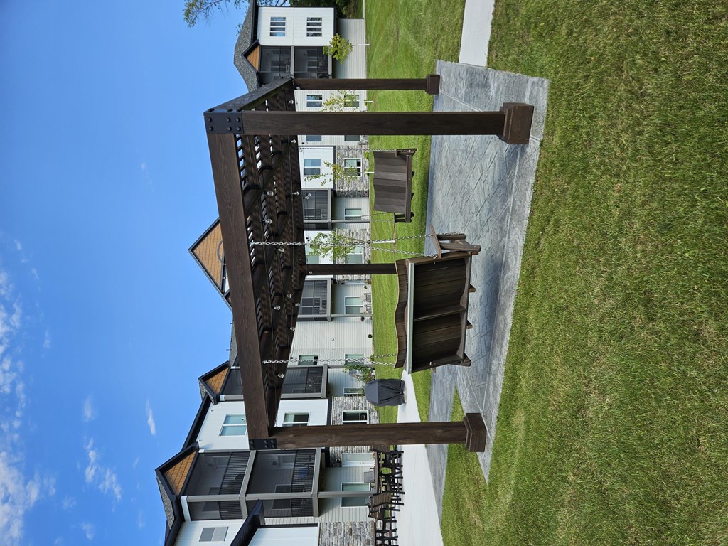 A building with a green lawn in front of it.