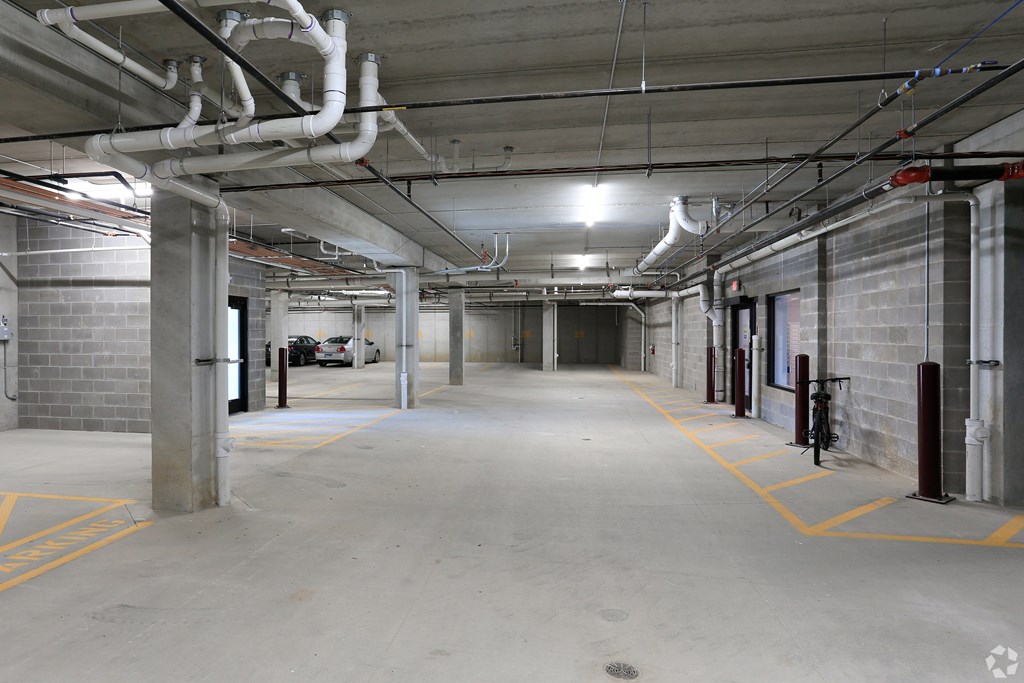 A spacious parking garage with concrete floors and multiple levels.