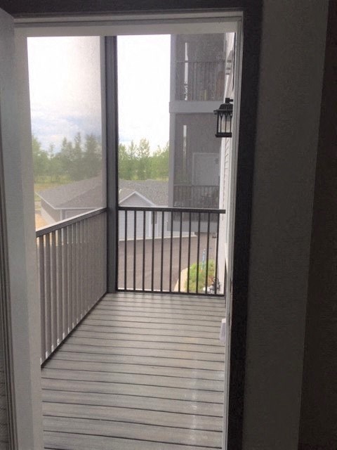 a view of a balcony from a door